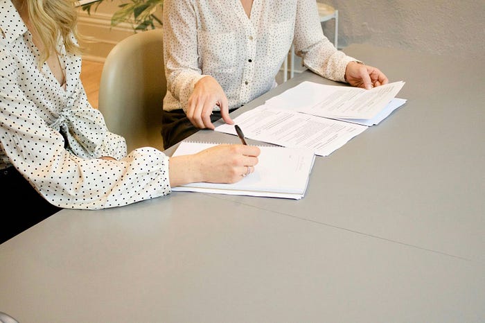 Hiring Managers looking at a Resume.